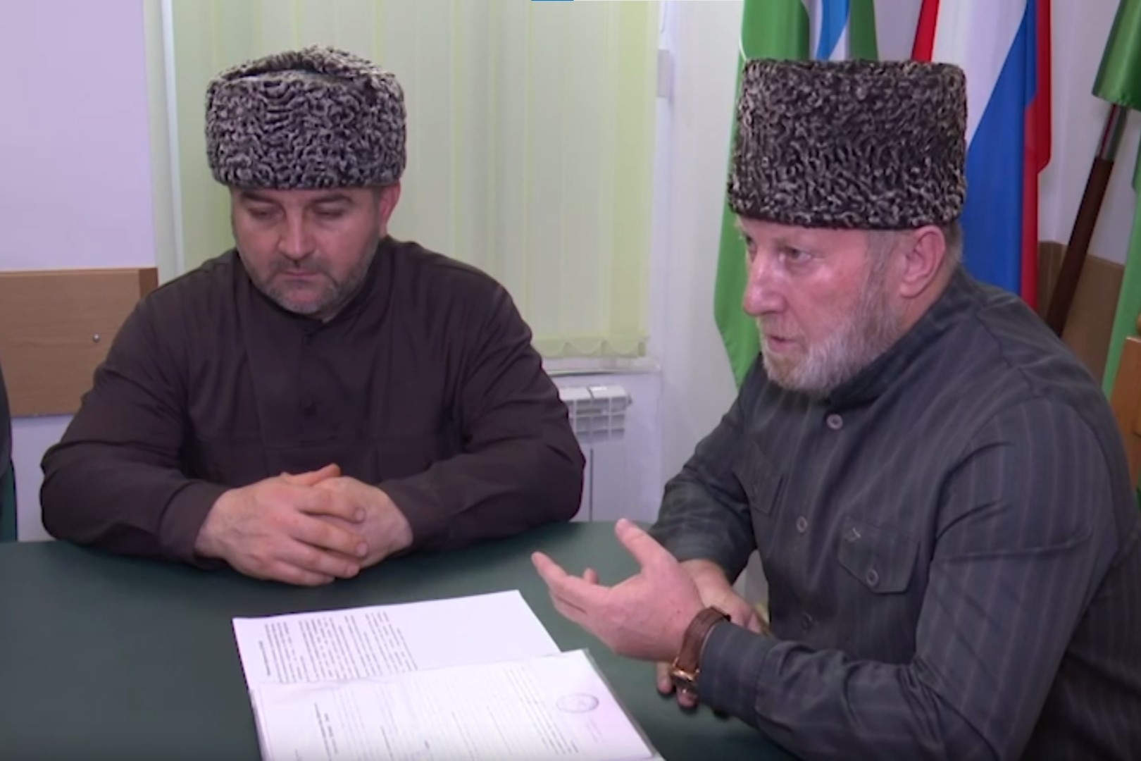 Hazrataliy Dzaseshev, the head of the Spiritual Administration of Muslims in Kabardino-Balkaria, chastising a boy for mocking the Quran. Screengrab via Telegram.