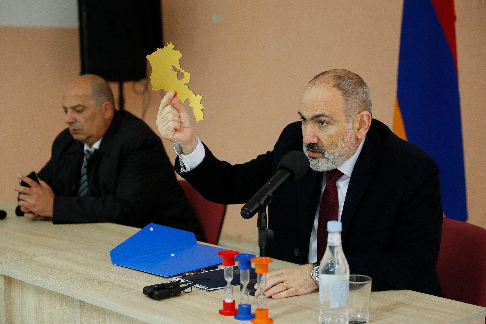 Nikol Pashinyan holds up a map of Armenia during his visit to border communities in Tavush Province on 18 March 2024. Official image.