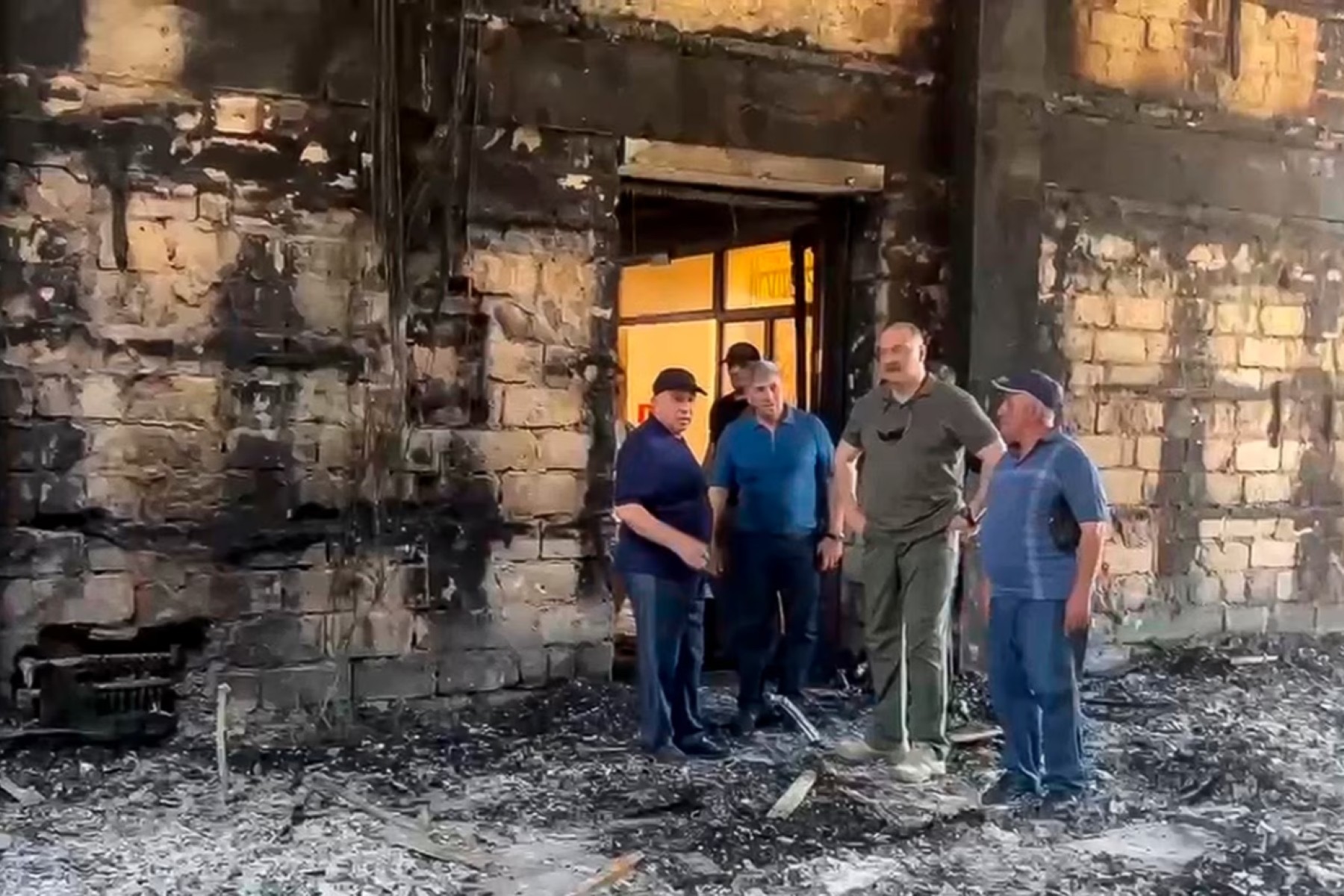 Head of Daghestan Sergei Melikov visits a synagogue set on fire in Sunday's attacks. Photo: RFE/RL