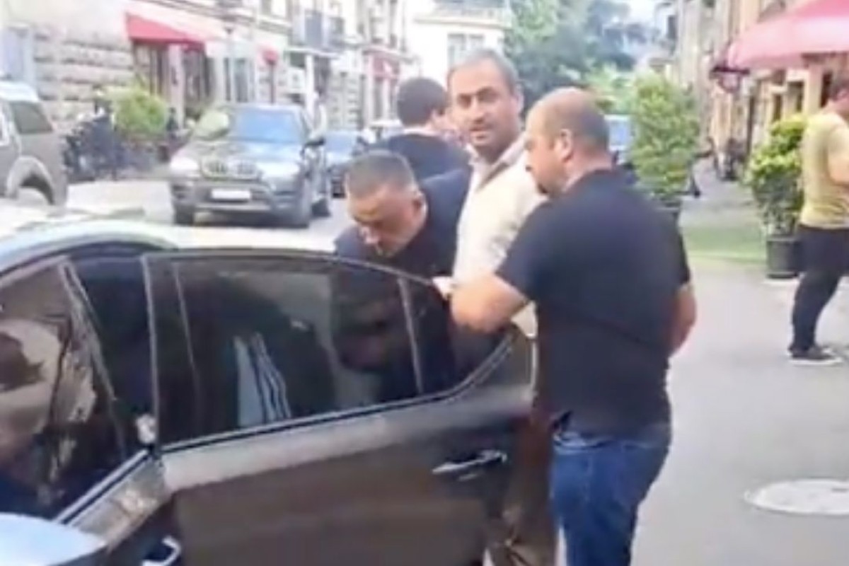 Azerbaijani journalist Afgan Sadigov being detained by Georgian police in Tbilisi. Screengrab via social media.