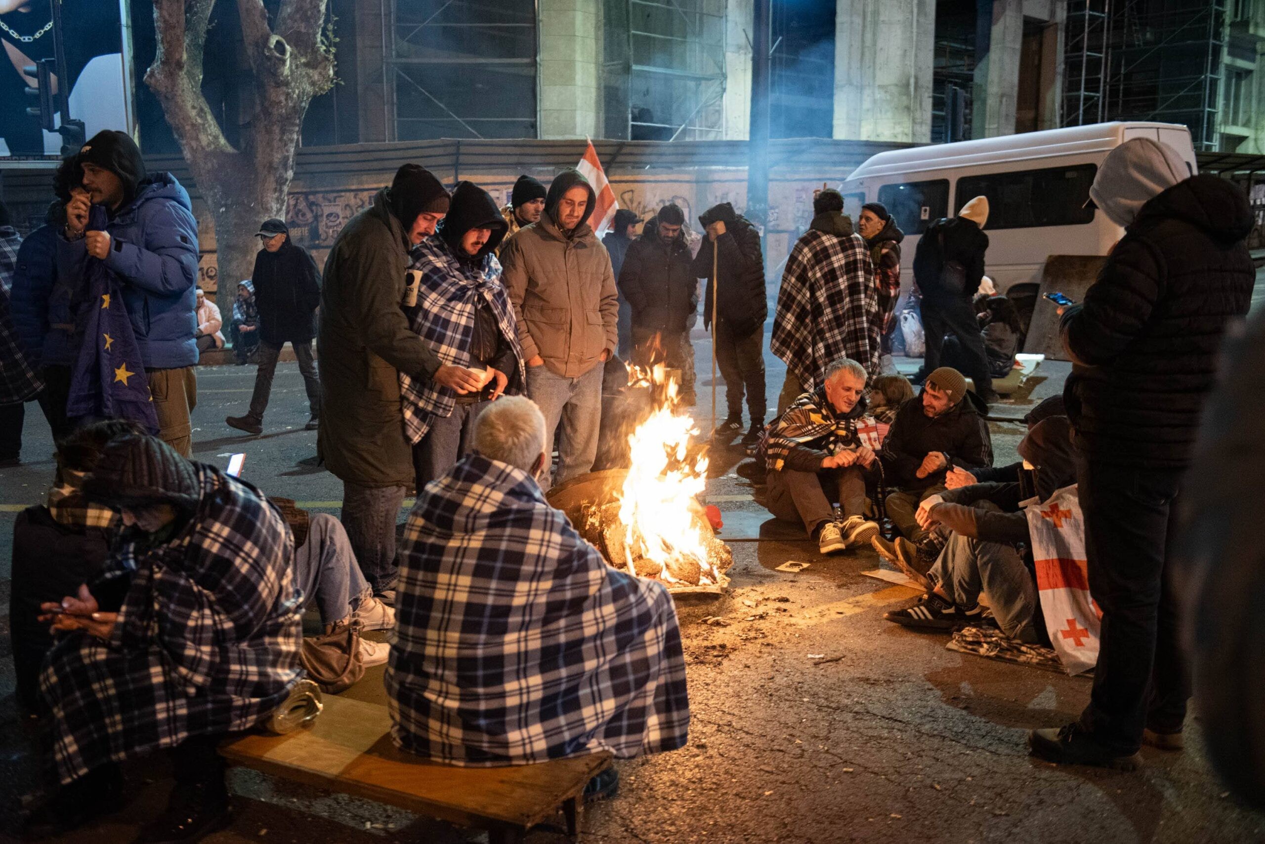 Some protesters spent the night in tents on Tbilisi’s Varaziskhevi Street on Sunday night, while others gathered around makeshift fires to keep warm. Photo: Mariam Nikuradze/OC Media.