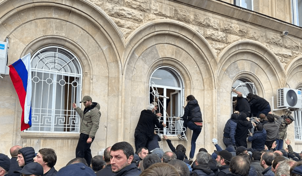 Protesters storm the parliament building in Abkhazia during a demonstration against controversial investments legislation. Image via Caucasian Knot