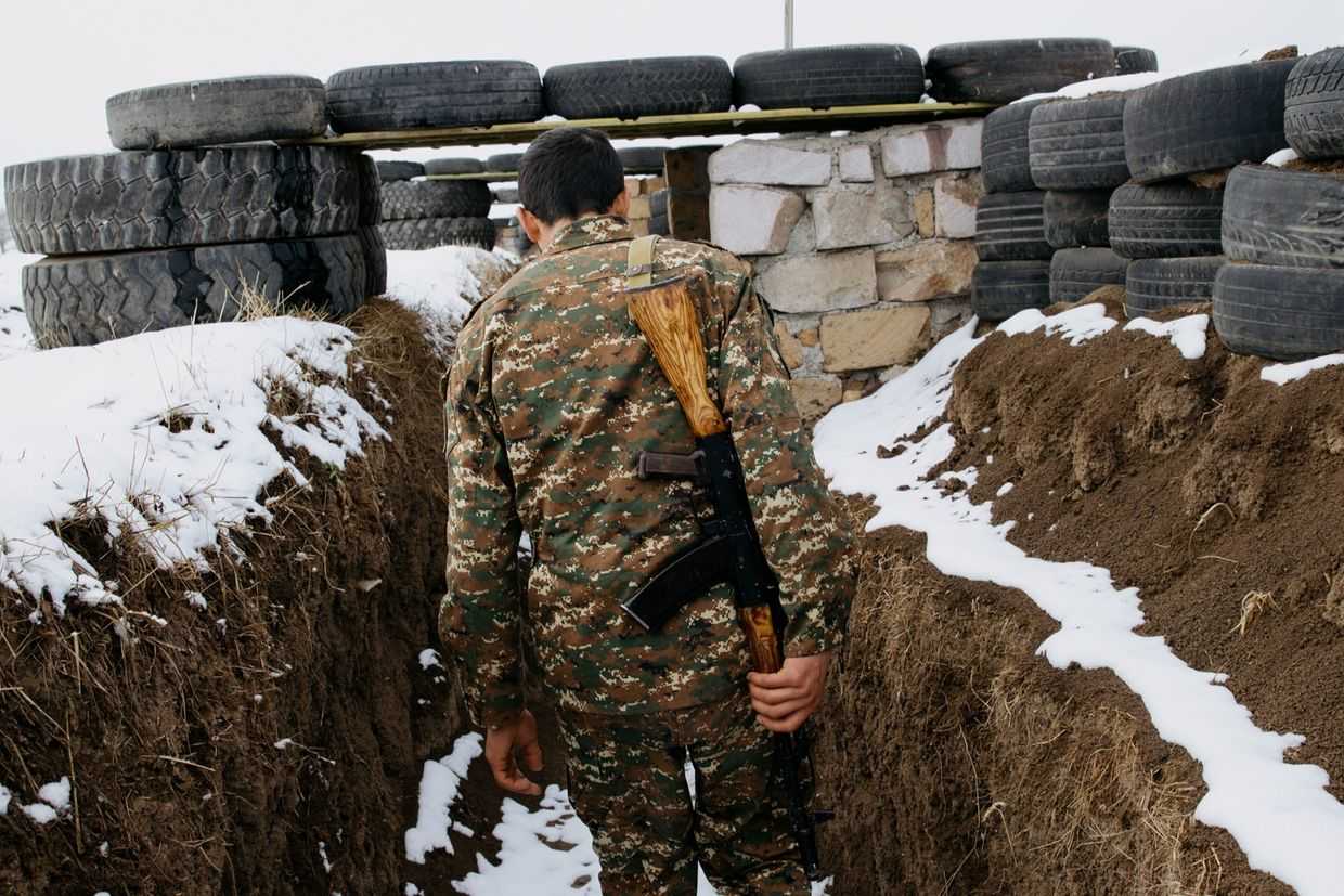 An Armenian soldier in the trenches on the border with Azerbaijan. Photo: Tom Videlo/OC Media.