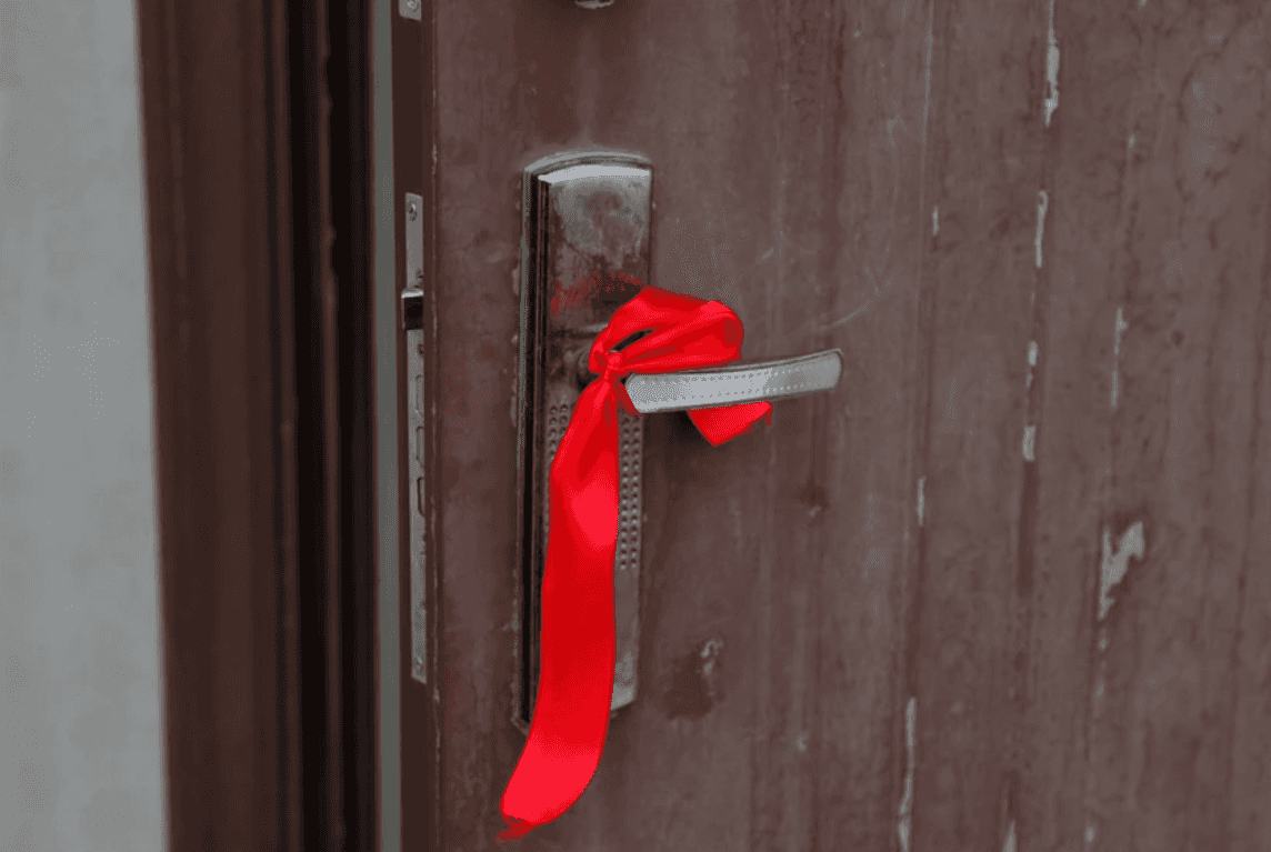 For Azerbaijanis, a red ribbon tied on a door means that someone in the house has recently gotten married. Photo: Lala Aliyeva/Chai-Khana.