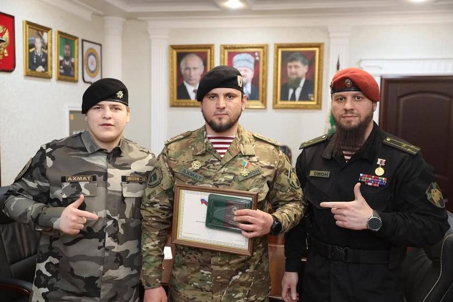 Adam Kadurov and riot police officers. Photo: social media.