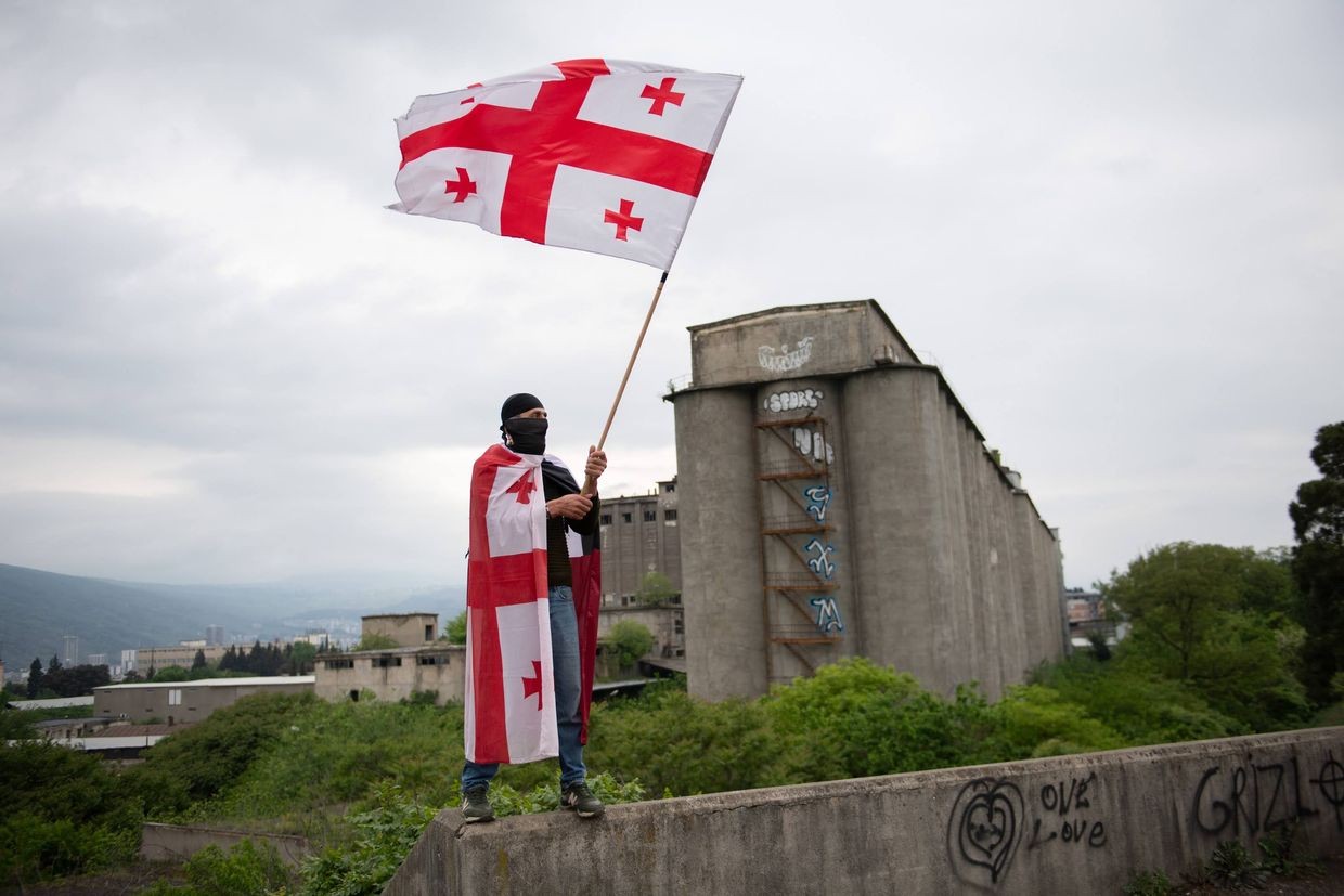 Protester with a Georgian flag during the 4 May rally in a Tbilisi suburb. Photo: Mariam Nikuradze/OC Media