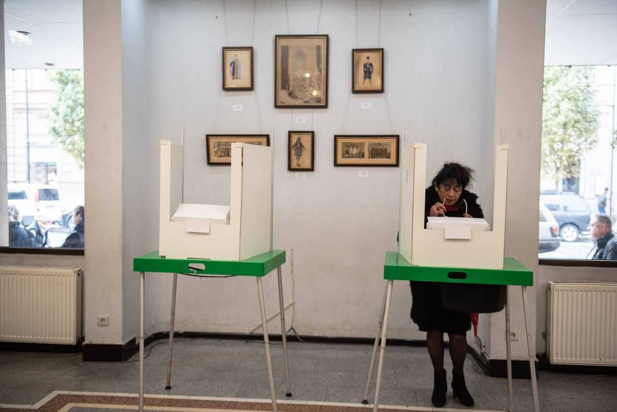 A woman casts her ballot during the 2024 Parliamentary elections in Georgia. Photo: Mariam Nikuradze/OC Media.