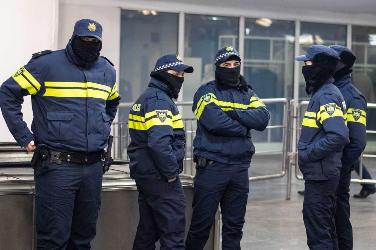 Police, with their faces covered, patrol a metro station during the protests on Rustaveli Avenue in December 2024. Photo: Mariam Nikuradze/OC Media.