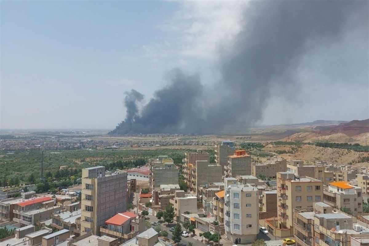Smoke billows into the sky after an Israeli strike on a military airport outside Iran’s northwestern city of Tabriz on 13 June. Photo: Tasnim.
