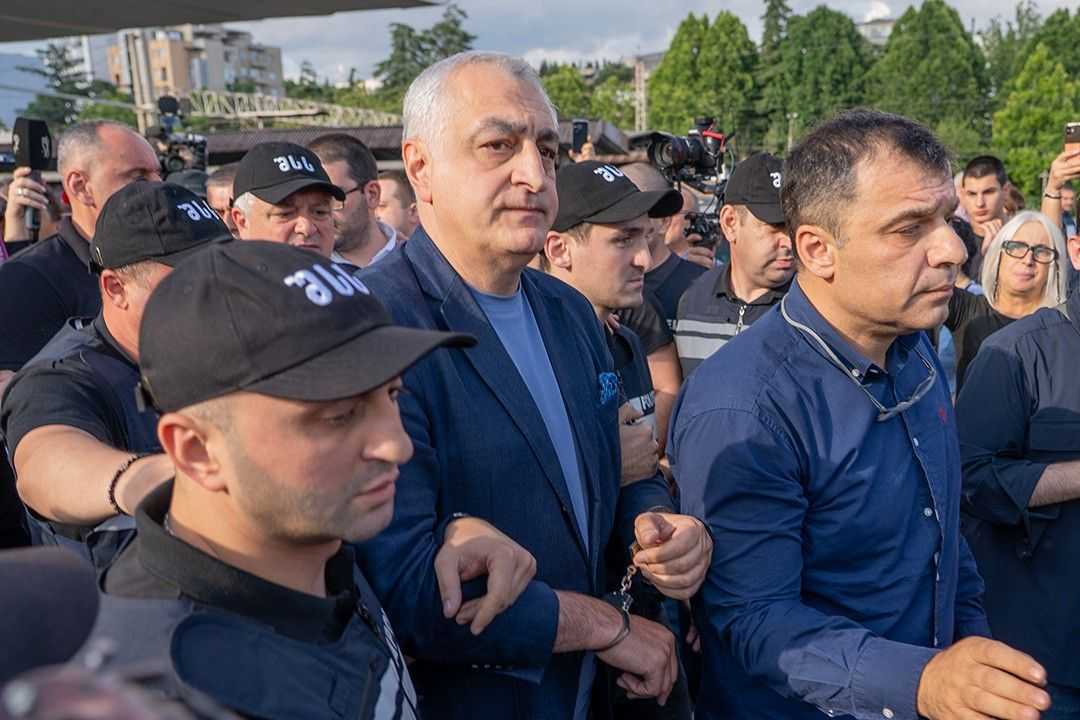 Lelo party leader Mamuka Khazardze being led away in handcuffs. Photo: RFE/RL.