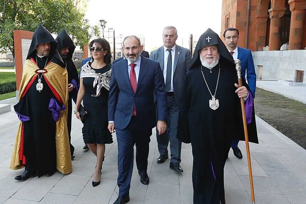 Prime Minister Nikol Pashinyan and his wife Anna Hakobyan walking along with Karekin II, the Head of the Armenian Church, at the opening of renovated Catholicosate of the Mother See of Holy Etchmiadzin in 2019. Official photo.