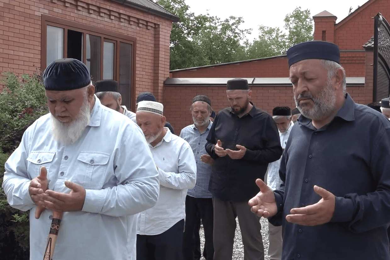 Reconciliation of families involved in blood feud. Screengrab from video.