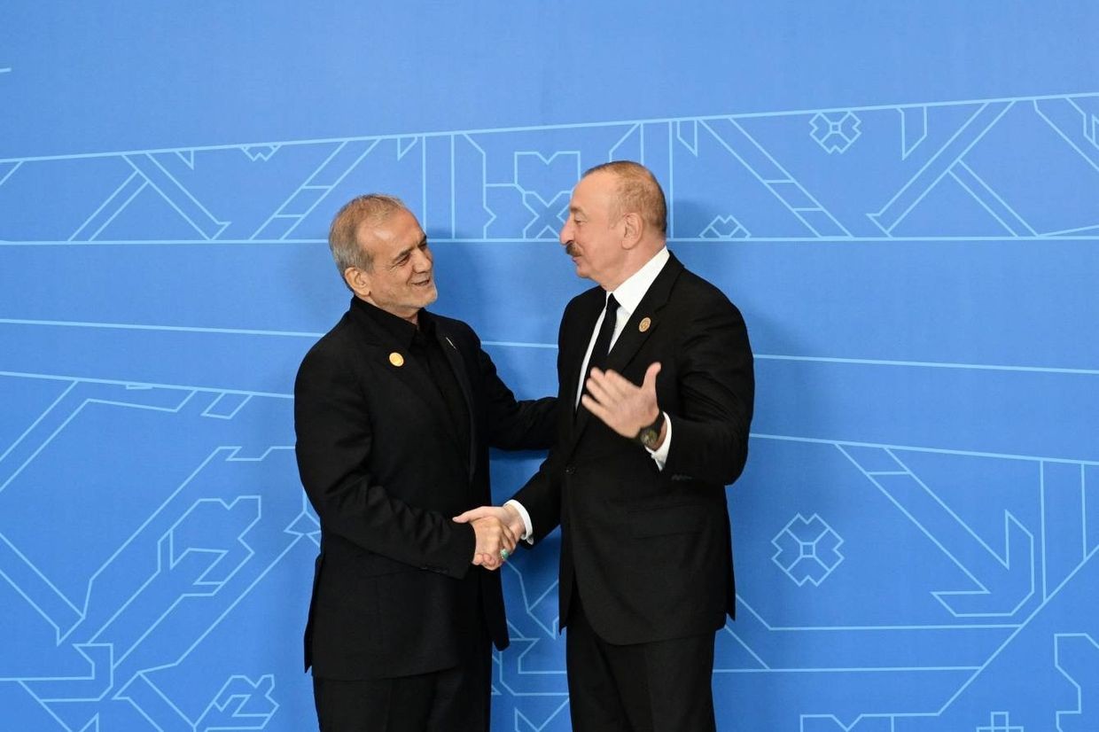Iranian President Masoud Pezeshkian (left) and Azerbaijani President Ilham Aliyev (right) at the ECO conference on 4 July 2025. Official photo.