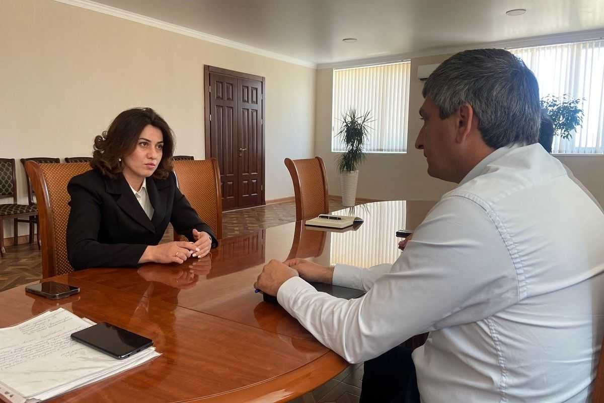 Abkhazian Education Minister Khana Gunba (left). Official photo.