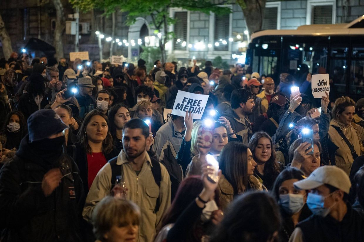 A protester holds a poster reading ‘Free Media!’ at a rally in Tbilisi. Pbhoto: Mariam Nikuradze/OC Media