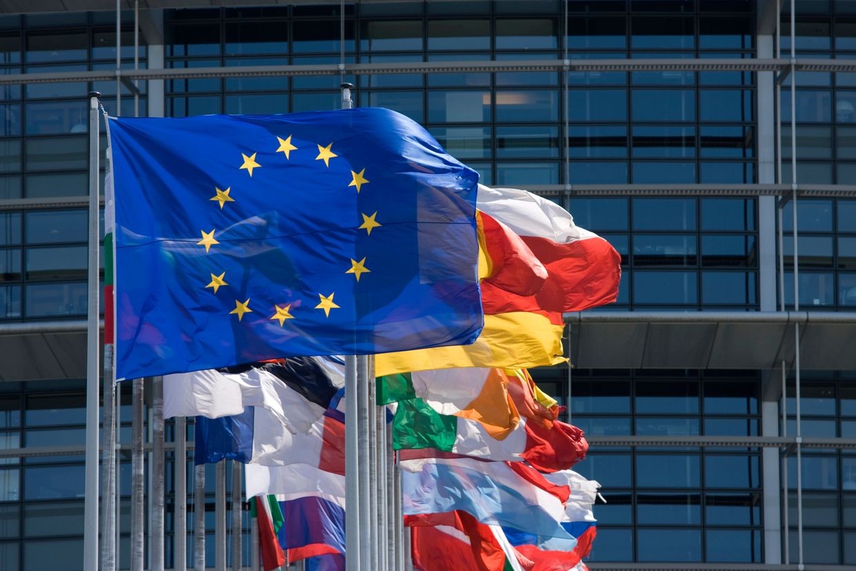 The EU flag flying in front of other flags from EU member states. Photo: Danish Foreign Ministry.