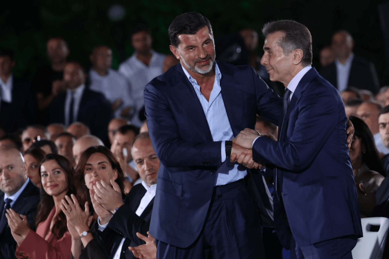 Tbilisi Mayor Kakha Kaladze (left) shakes hands with Georgian Dream founder Bidzina Ivanishvili during his re-election candidacy ceremony. Photo via social media.