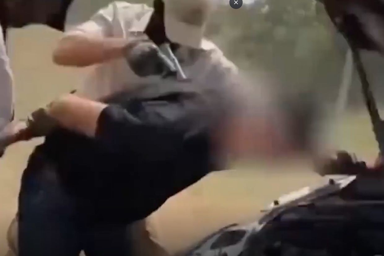 Russian law enforcement detaining a man suspected of transporting explosives into Russia. Screengrab via TASS.