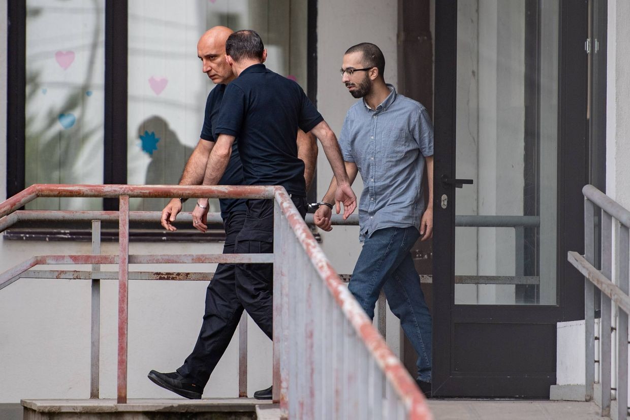 Archil Museliantsi leaving a school after passing his national university entrance exams in July while in detention. Photo: Mariam Nikuradze/OC Media.