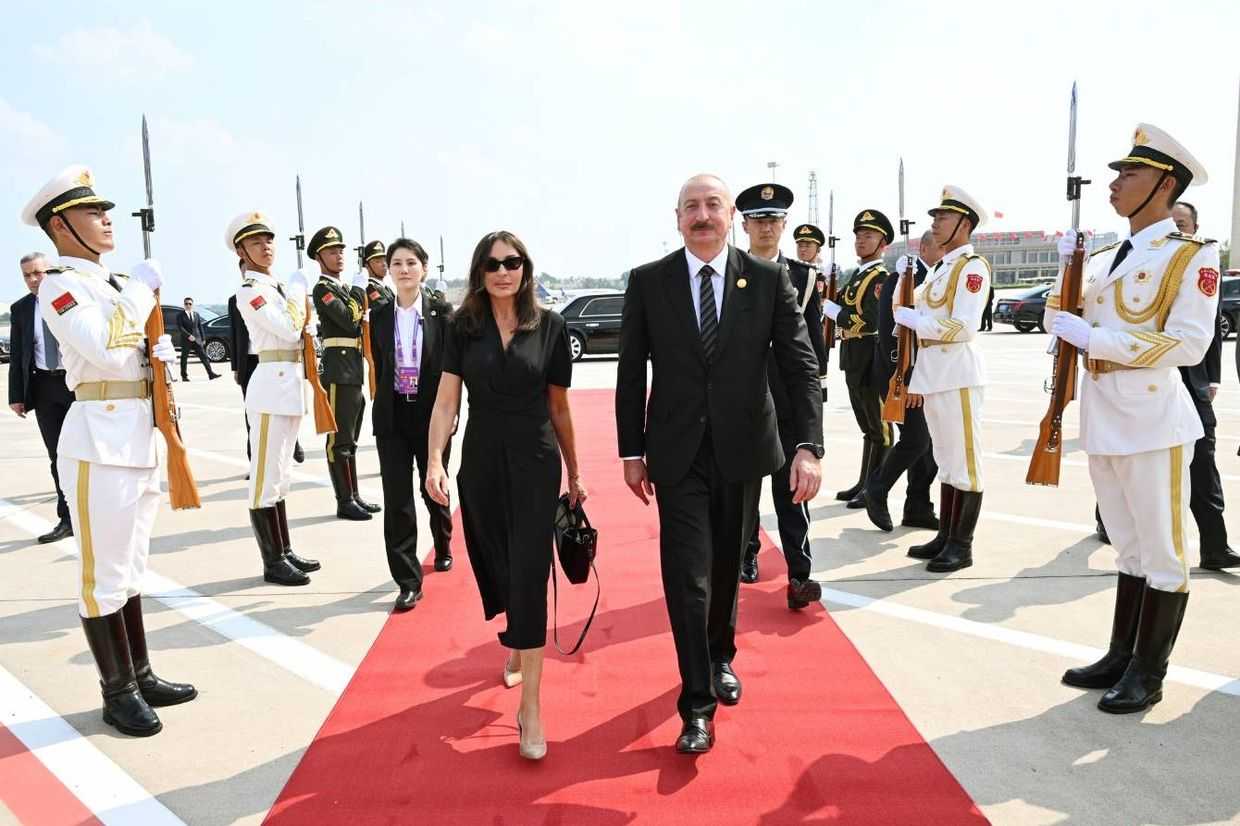 Azerbaijani President Ilham Aliyev (center right) and First Lady Mehriban Aliyeva departing from the airport in Beijing following the SCO summit. Official photo.