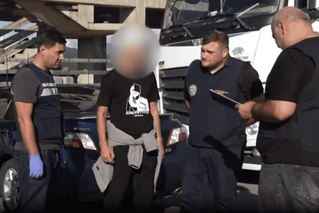 Officers from Georgia’s State Security Service (SSG) interrogate a suspect in the case. Screengrab from a video from the SSG.