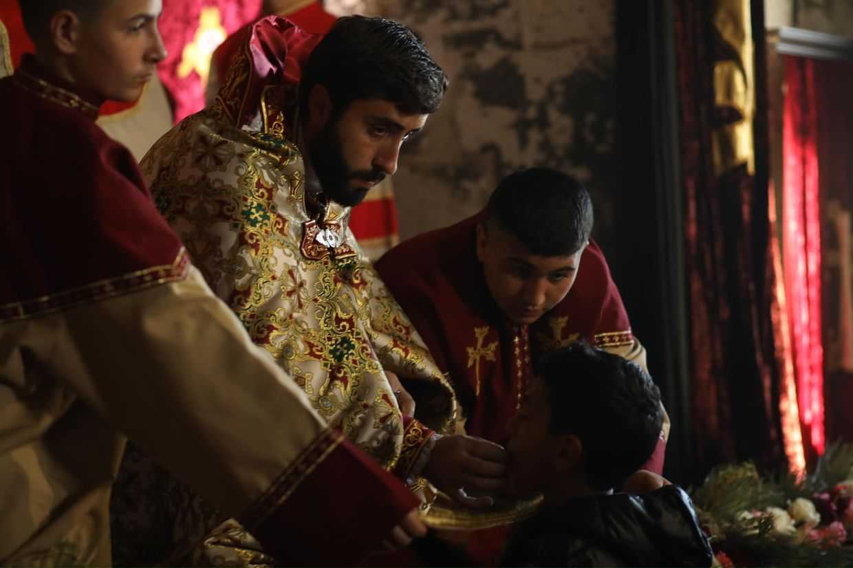 Father Aram during a mass. Image via Social Media