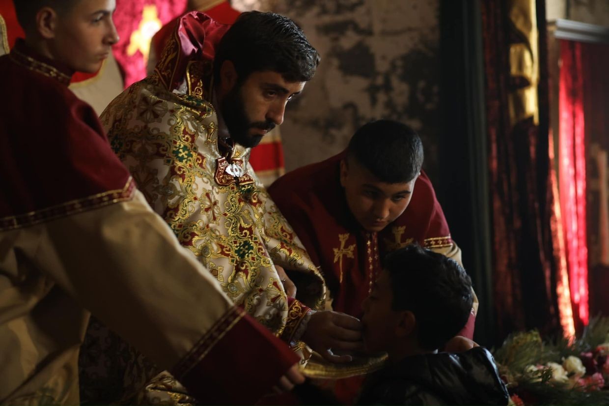 Father Aram during a mass. Image via Social Media