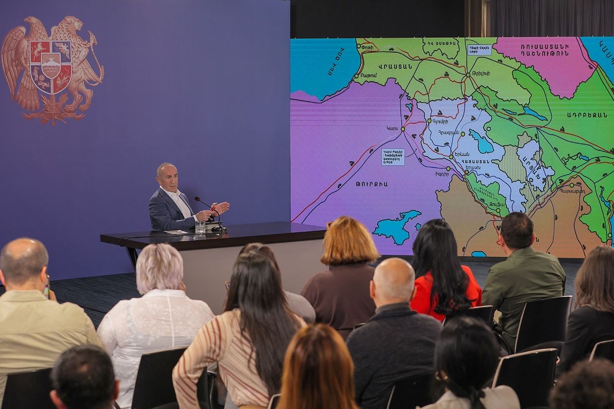 Kocharyan presents a map of Armenia showing Nagorno-Karabakh and surrounding regions as Armenian territory during his press conference. Photo via social media.