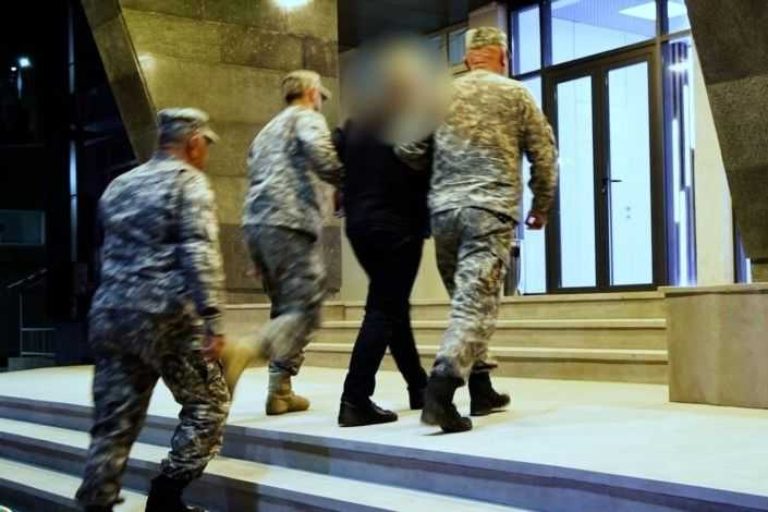 Former Deputy Infrastructure Minister Koba Gabunia being detained by law enforcement officials. Photo: Georgian Finance Ministry’s Investigation Service.