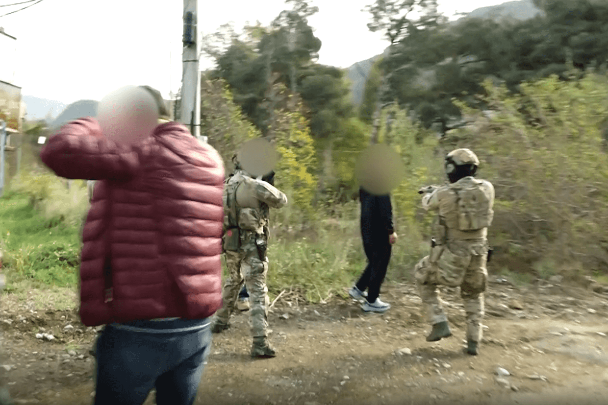 Screengrab from video showing SSG officers arresting the three suspects.