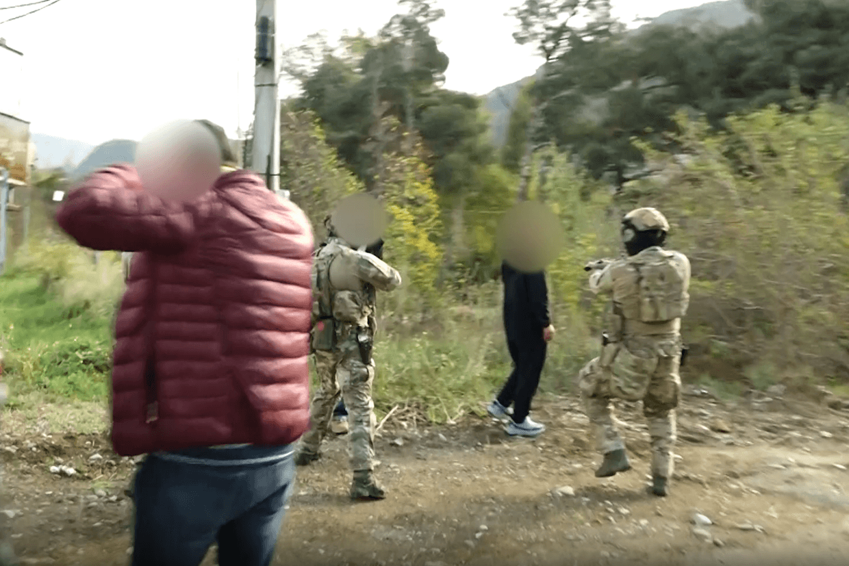 Screengrab from video showing SSG officers arresting the three suspects.
