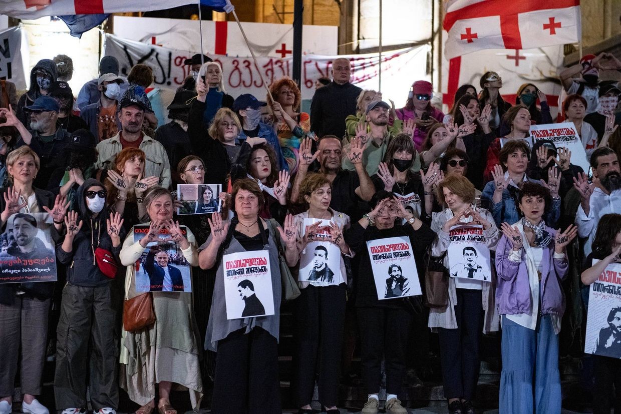Family members and supporters of the imprisoned protesters stand on Rustaveli Avenue on 24 June. Photo: Mariam Nikuradze/OC Media.
