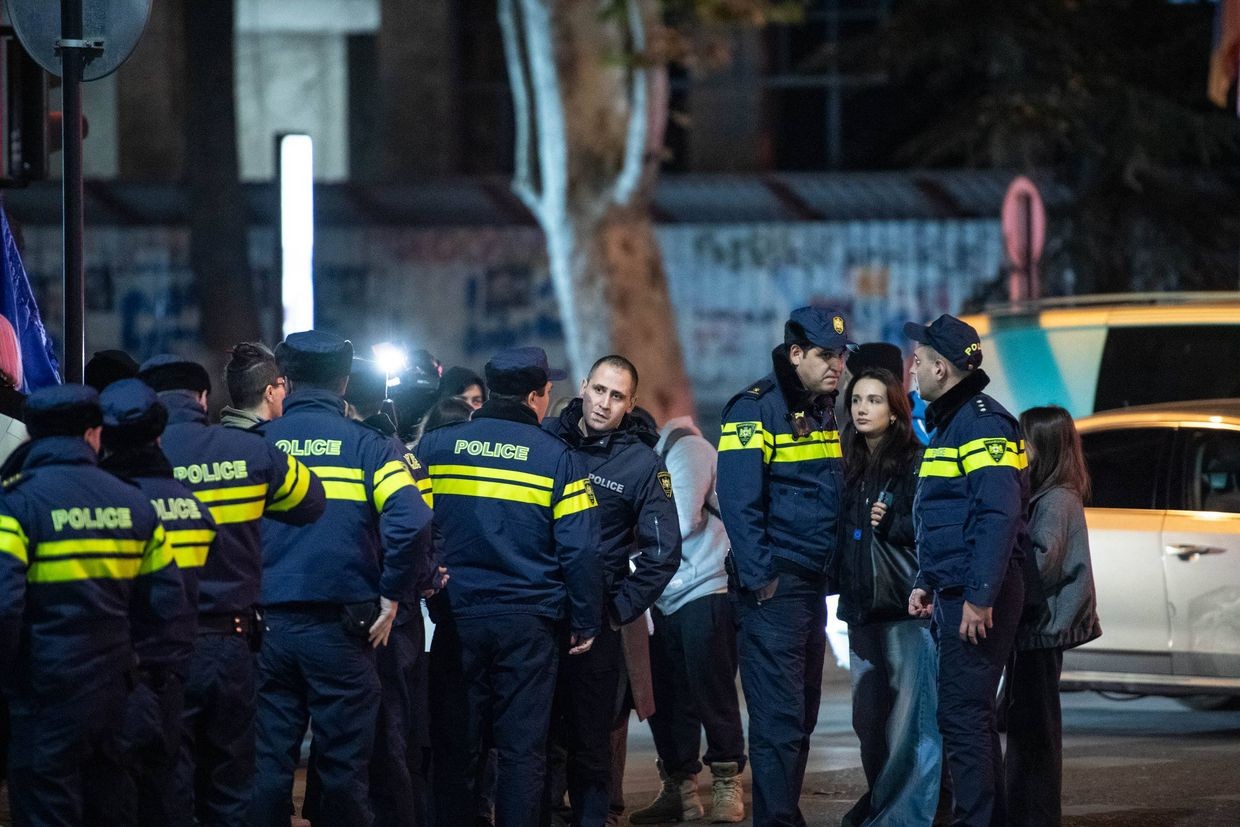 Police gather near a protest march in support of imprisoned 21-year-old Mate Devidze, who was originally detained one year ago on 19 November 2024. Photo: Mariam Nikuradze/OC Media.