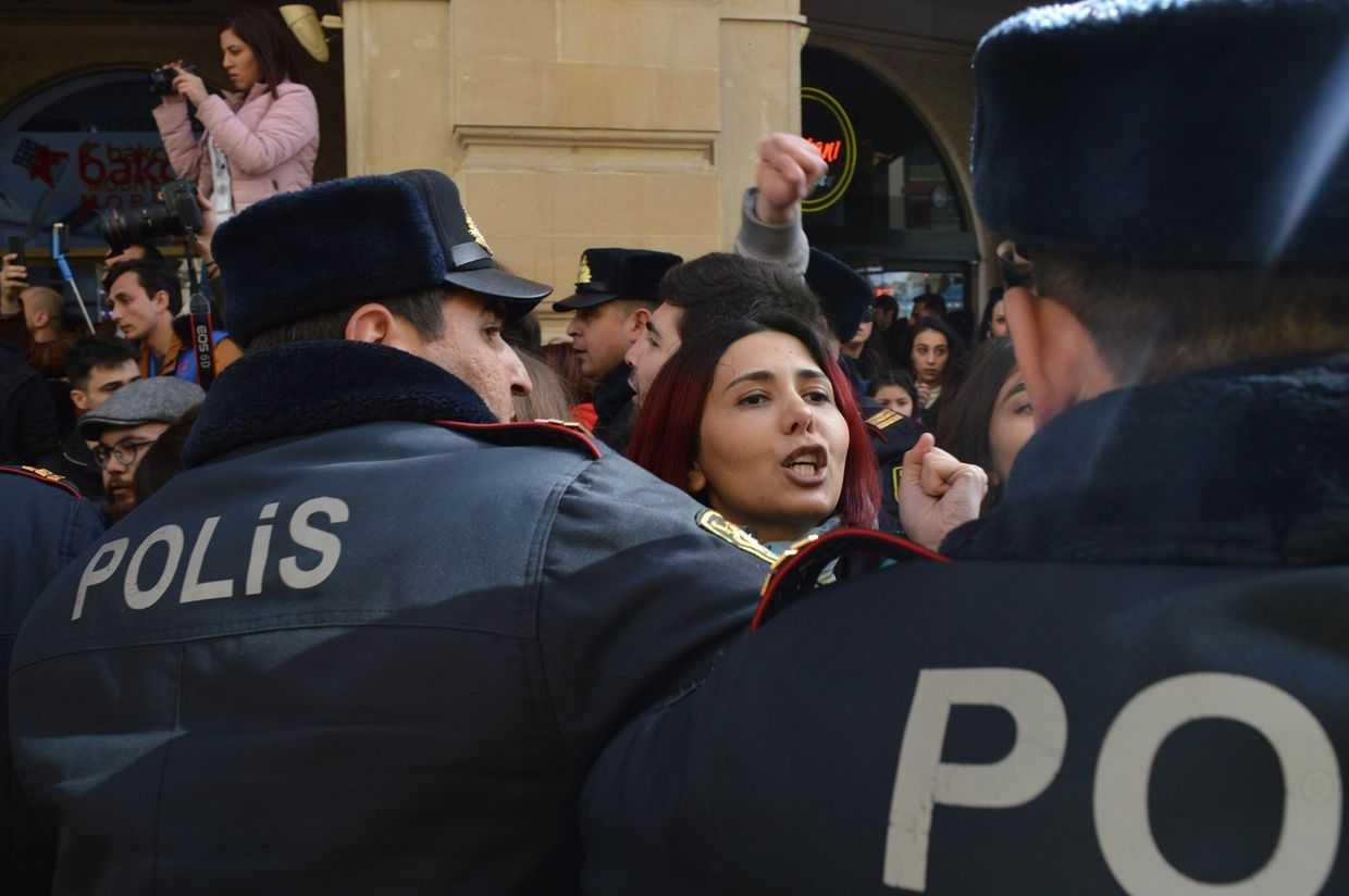 Azerbaijani activist Gulnara Mehdiyeva surrounded by police as they break up a 2020 demonstration. Photo: Vugar Mirzabey.