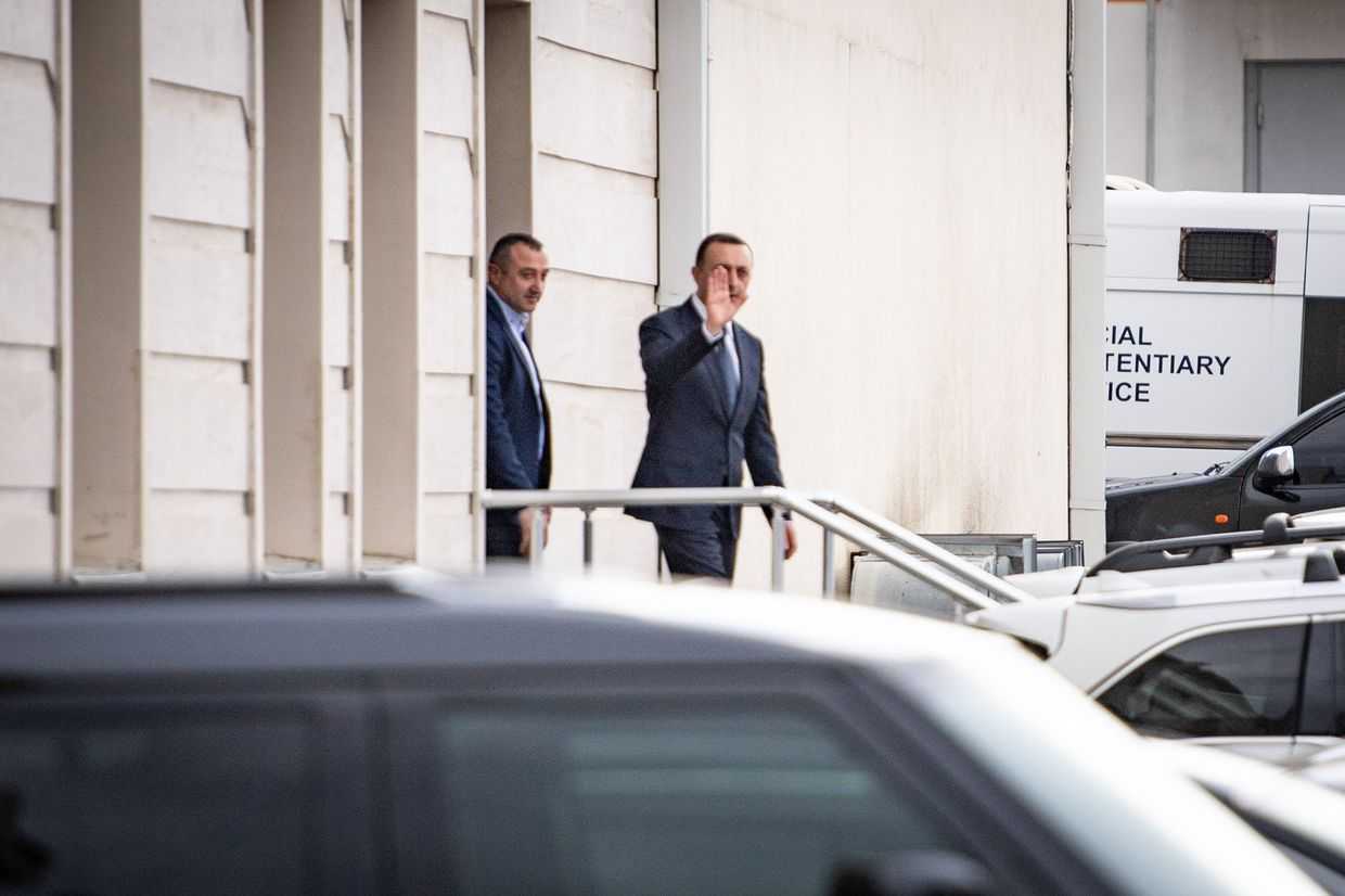 Irakli Gharibashvili waves to journalists after a court hearing in October. Photo: Mariam Nikuradze/OC Media.
