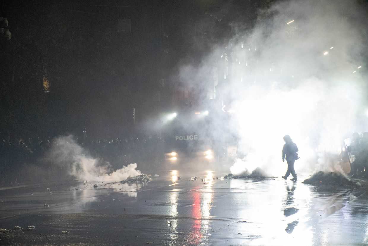 Tear gas lingers in the air in front of a water cannon vehicle during the demonstrations on 28–29 November 2024. For illustrative purposes. Photo: Mariam Nikuradze/OC Media.