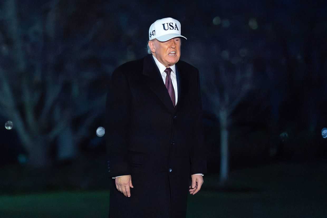 President Donald Trump talks to reporters as he walks on the South Lawn of the White House on11 January. Photo: Jose Luis Magana / AP Photo