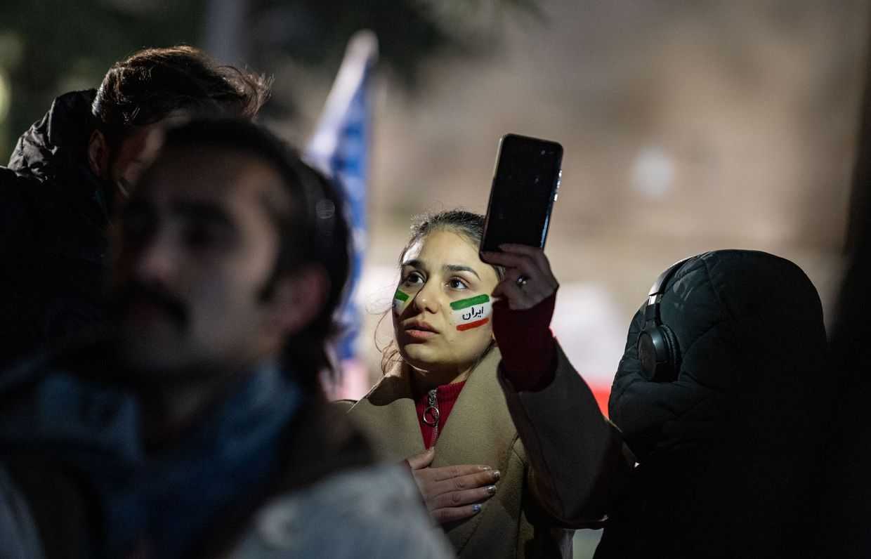 A demonstrator with her face painted in the colours of the Iranian flag at a solidarity rally for the Iranian protest movement in Tbilisi. Photo: Mariam Nikuradze/OC Media.