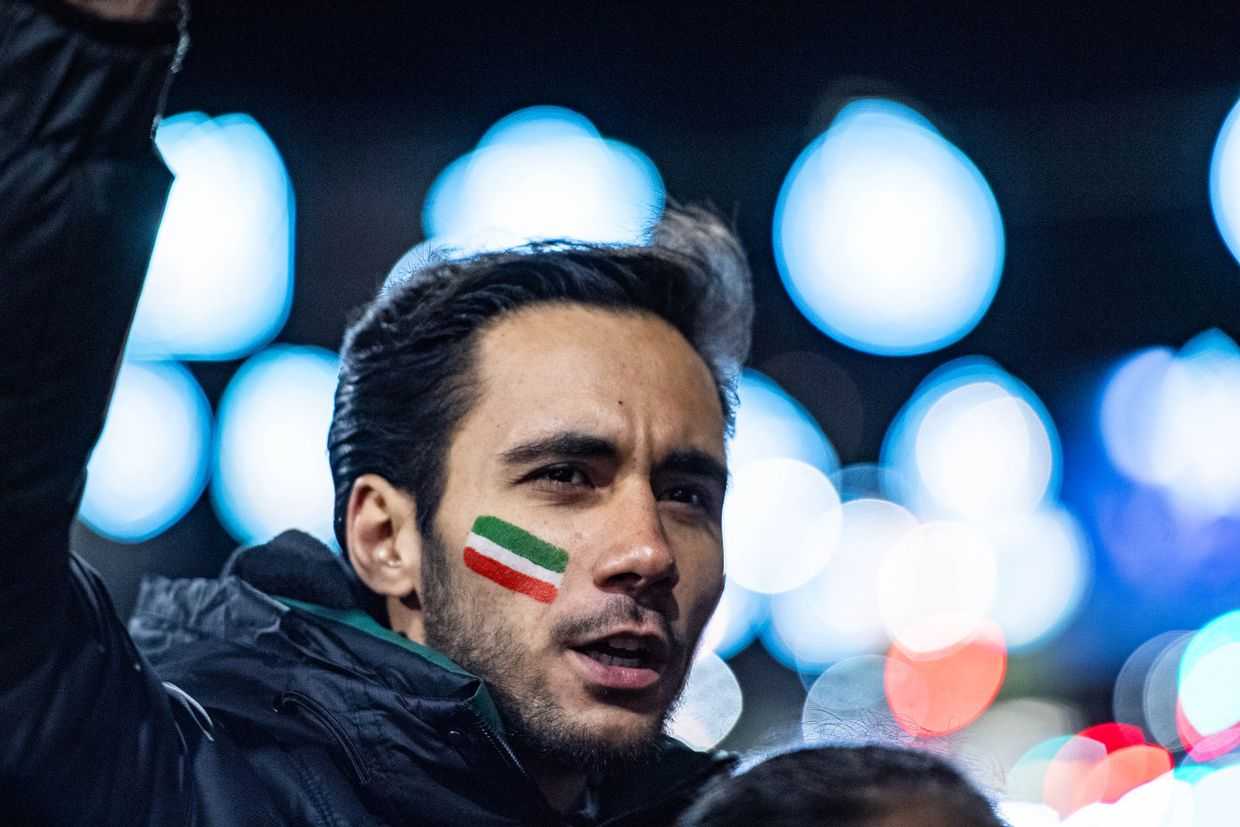 A demonstrator with his face painted in the colours of the Iranian flag at a solidarity rally for the Iranian protest movement in Tbilisi. Photo: Mariam Nikuradze/OC Media.