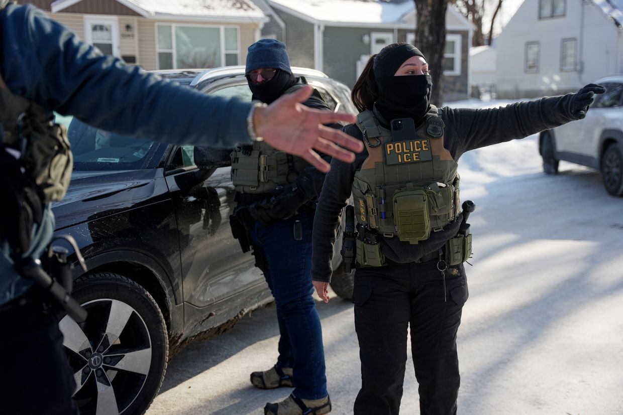 US Federal immigration officers stop a vehicle in Minneapolis on 23 January 2026. Photo: Angelina Katsanis/AP Photo.