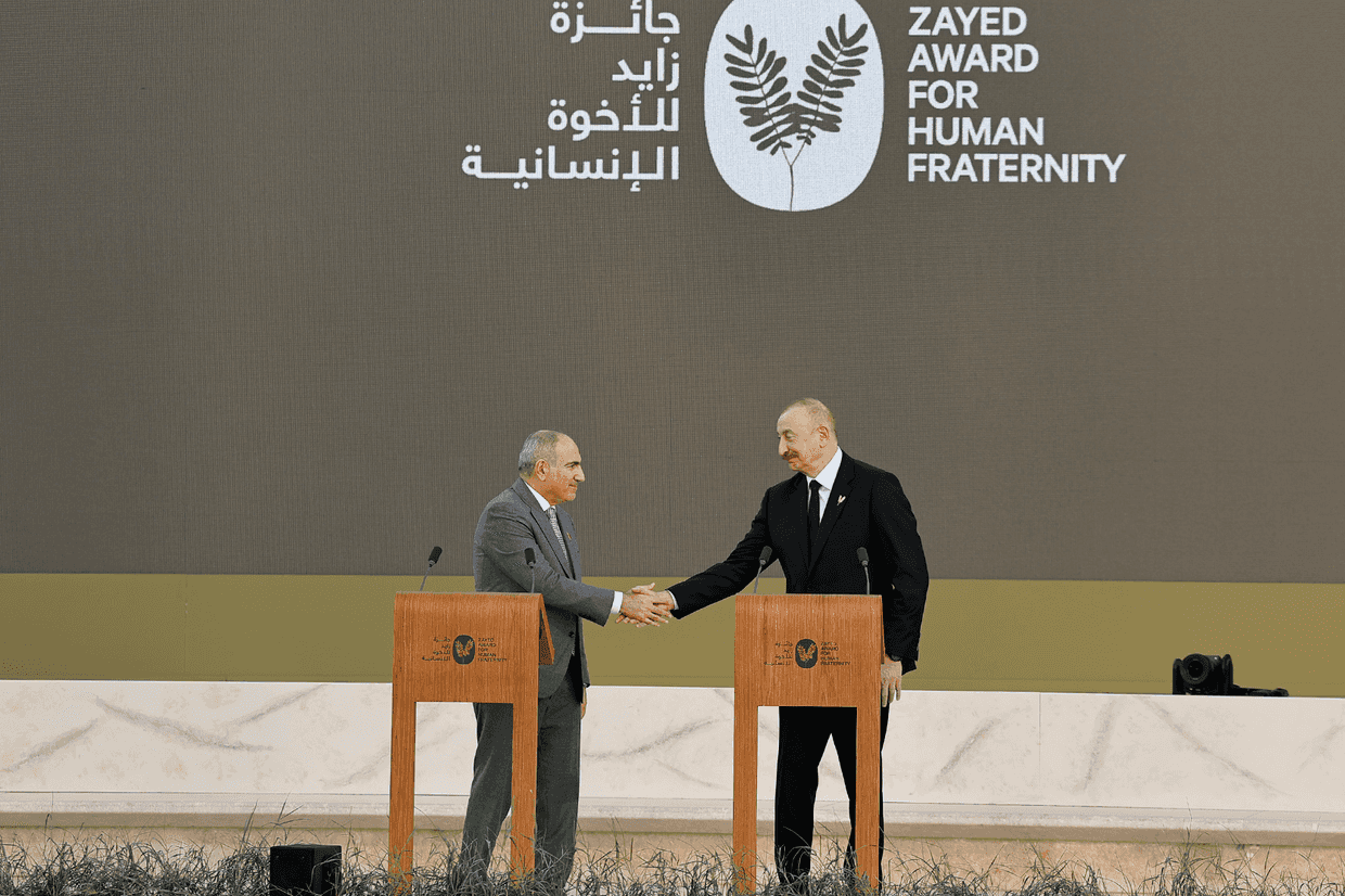 Armenian Prime Minister Nikol Pashinyan (left) and Azerbaijani President Ilham Aliyev (right) shaking hands after delivering speeches at the Zayed Award for Human Fraternity 2026 ceremony. Official photo.