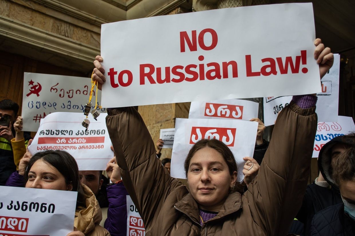 A protester holding a sign against Georgian Dream's first attempt to pass foreign agents law in March 2023. Photo: Mariam Nikuradze/OC Media.