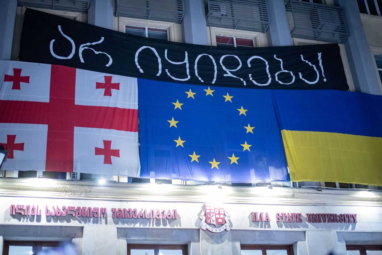 A banner above the main entrance to Ilia State University reads ‘Not for sale’. Photo: Mariam Nikuradze/OC Media.