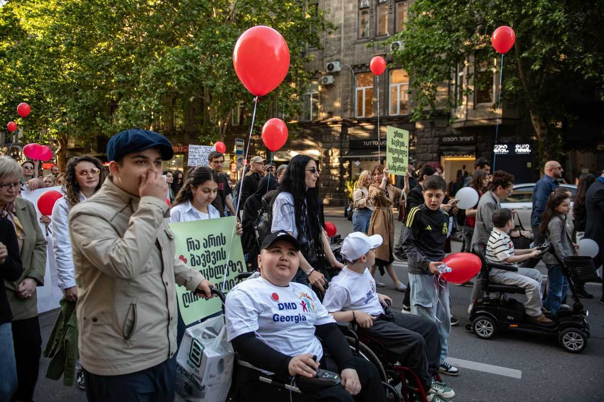 Children with Duchenne Muscular Dystrophy (DMD), their families, and supporters march to demand access to medication on 17 May 2026 in Tbilisi. Photo: Mariam Nikuradze / OC Media.