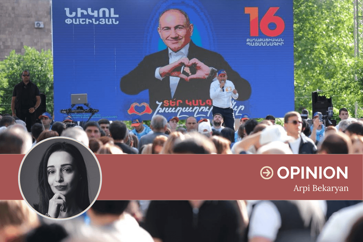 Armenian Prime Minister Nikol Pashinyan campaigning in front of an election banner in May 2026. Photo via social media.