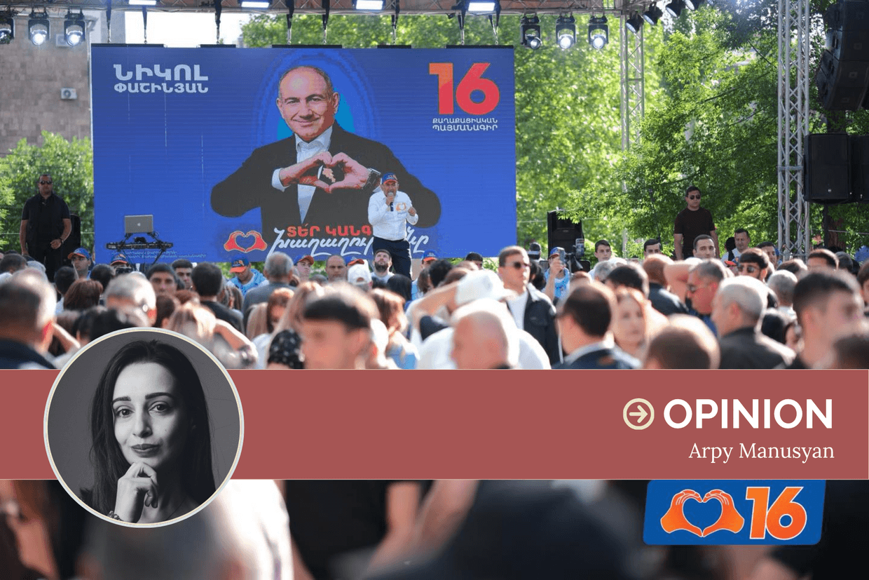 Armenian Prime Minister Nikol Pashinyan campaigning in front of an election banner in May 2026. Photo via social media.