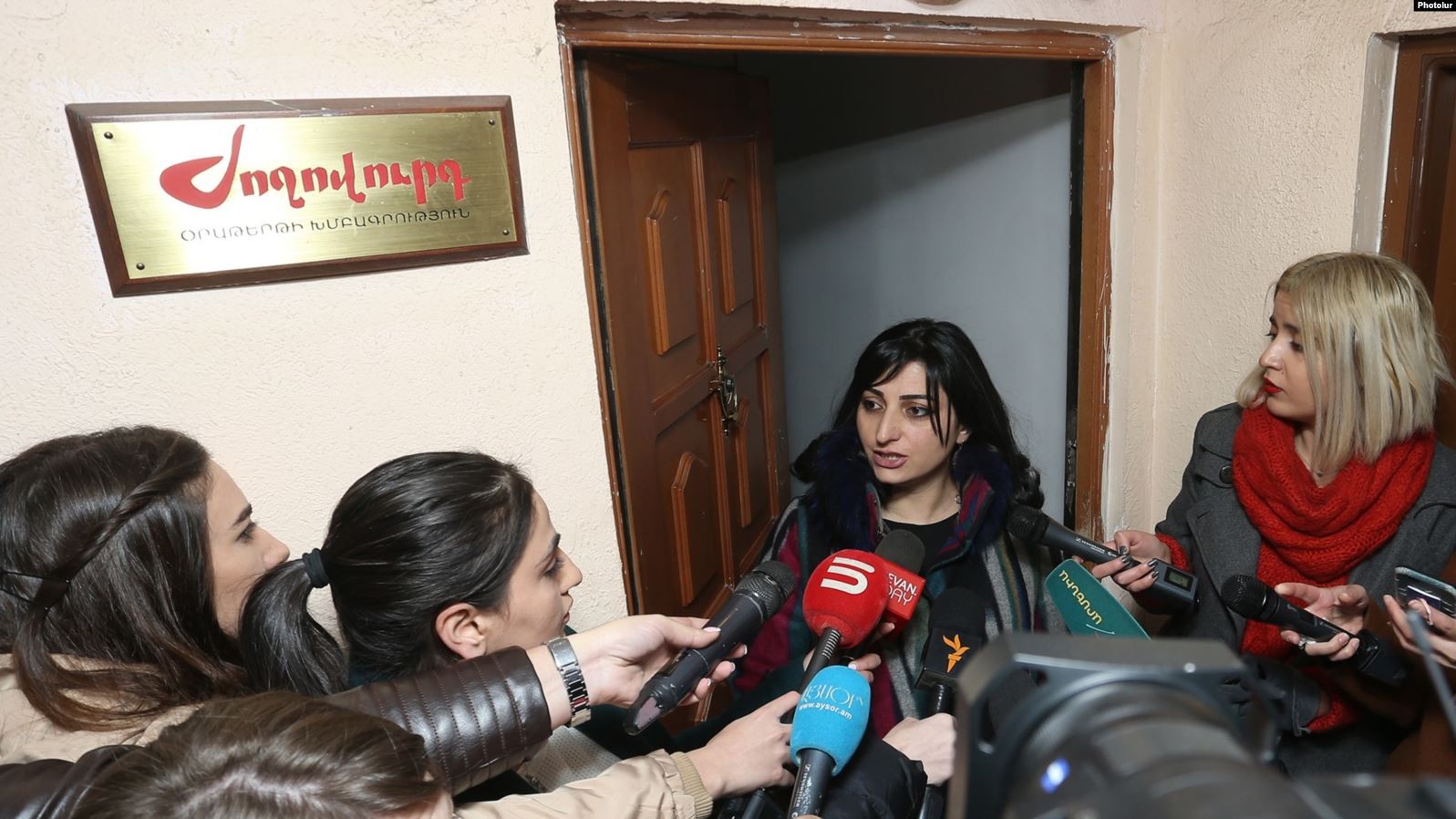 Taguhi Tovmasian speaks to reporters. Image via RFE/RL.