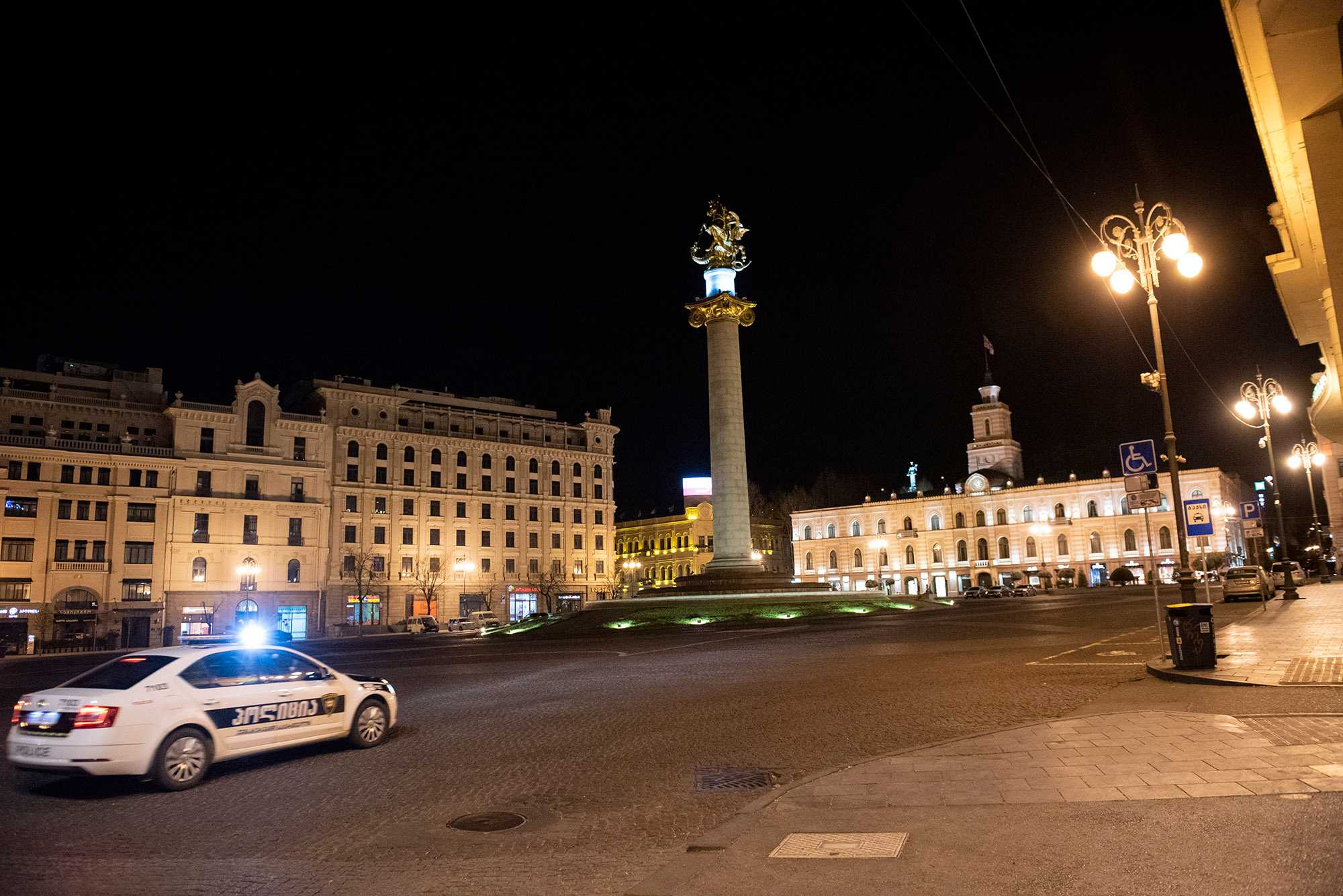 A police car on Freedom Square during curfew. Photo: Mariam Nikuradze/OC Media.