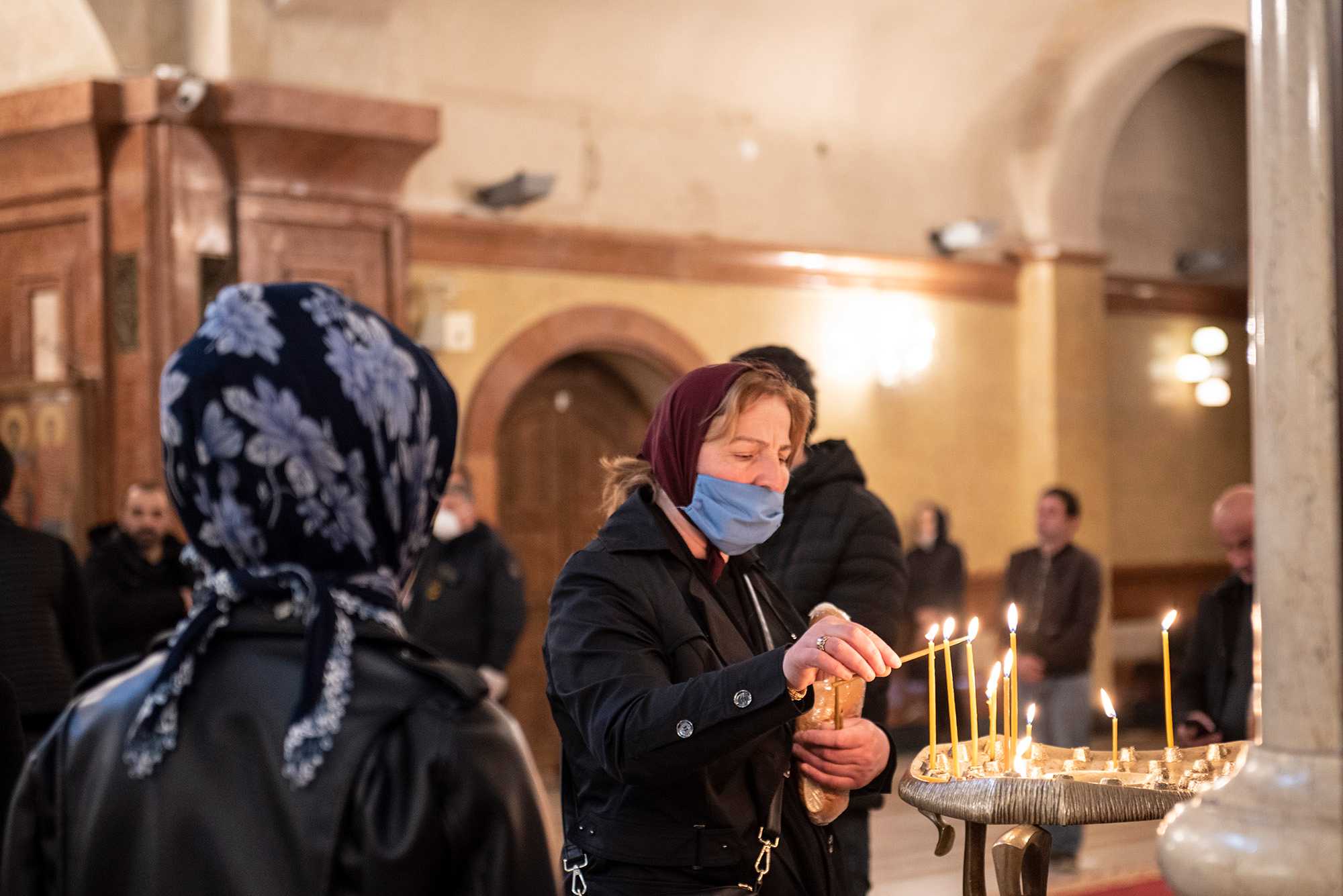 A woman lighting a candle in Tbilisi's Sameba Trinity Cathedral on 7 April. Photo: Mariam Nikuradze/OC Media.