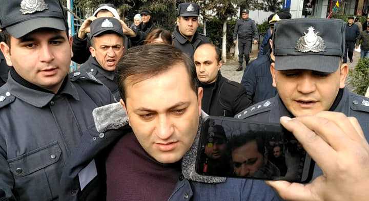 Ruslan Izzetli being detained during a protest on 11 February against February’s elections results. Photo Fatima Movlamli.